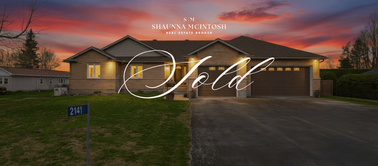 SOLD waterfront bungalow at 2141 River Road Kemptville South Rideau River exterior dusk